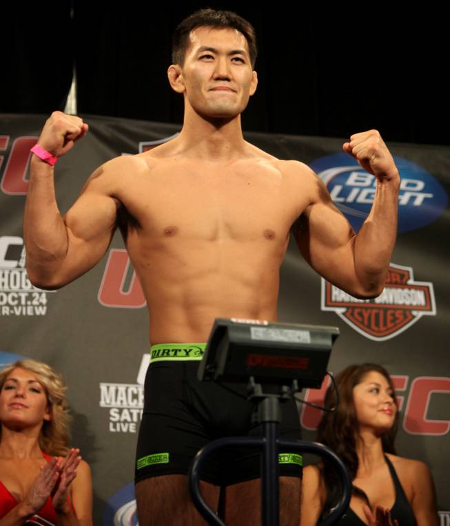 Yushin Okami on the scale during the UFC 104 weigh-ins at the L.A. Live Event Deck in Los Angeles.