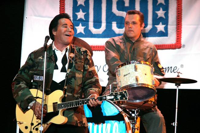 Wayne Newton performs a simulated USO performance during the grand opening night of Wayne Newton's "Once Before I Go" at the Tropicana in Las Vegas Wednesday, Oct. 28, 2009. 