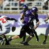 TCU quarterback Andy Dalton (14) fumbles the ball after being hit by UNLV cornerback Warren Zeigler (21) as UNLV cornerback Terrance Lee (23) and linebacker Beau Orth converge on the play in the first half Saturday, Oct. 31, 2009, in Fort Worth, Texas. 