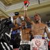 Yonnhy Perez (right) and Joseph Agbeko both raise their hands following their 12-round IBF bantamwei