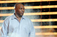Mike Tyson says he weighed 350 pounds, but has turned vegan and dropped 130.