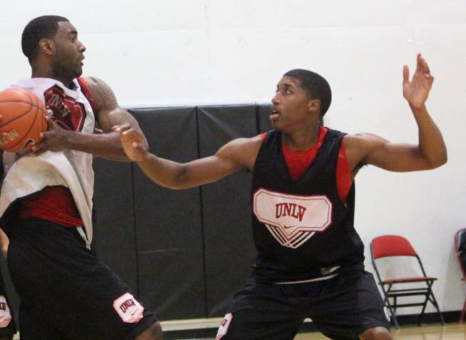 UNLV freshman Justin Hawkins defends Darris Santee during UNLV basketball practice at the Cox Pavilion Monday.