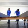 Todd Johnson, left, and Bill Montano, employees of Kama Energy Efficient Building Systems, assemble 