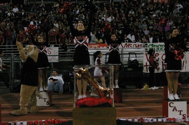 Las Vegas High School cheerleaders support their team behind Sir Herkimers Bone.