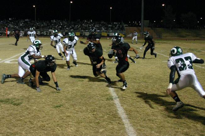 Las Vegas senior Maotoi Pearson (19) runs with the ball during the annual Bone Game against Rancho High School Thursday.