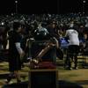 Las Vegas linebacker David Prieto (9) spends a moment with Sir Herkimers Bone before the annual game