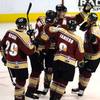 Bakersfield Condors come together in the second period to celebrate a power play goal scored by John de Gray (center) against the Wranglers on Thursday night.