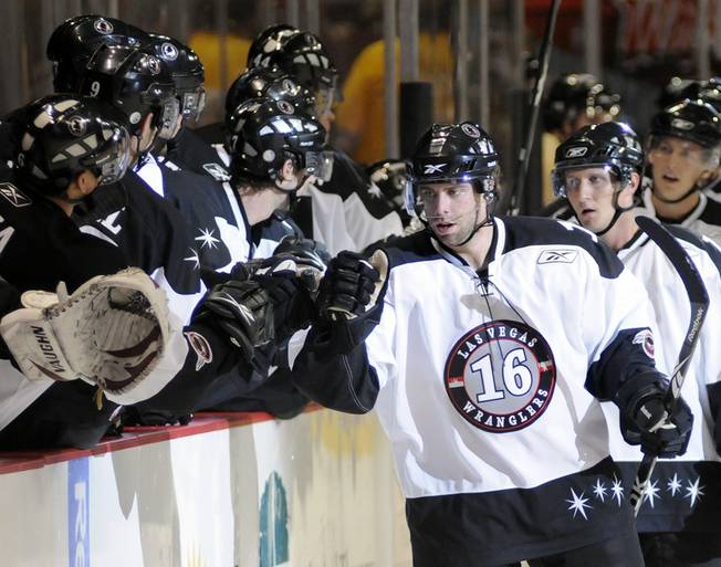Wranglers left winger Matt Watkins is congratulated by teammates after scoring for Las Vegas in the first period what would become the only goal for the home team on Thursday night.