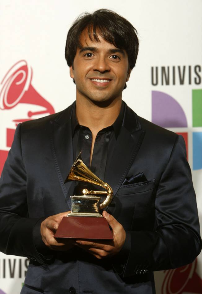 Luis Fonsi poses with the Grammy for Song of the Year at the 10th annual Latin Grammy Awards at the Mandalay Bay Events Center. The pair shared the award for "Aqui Estoy Yo" with Claudia Brant and Gen Rubin.