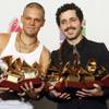 Rene Perez, left, and Eduardo Jose Cabra Martinez of the musical group Calle 13, pose with their awards at the 10th annual Latin Grammy Awards at the Mandalay Bay Events Center Thursday.