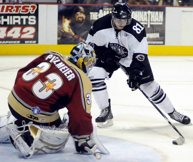 Wranglers forward Adam Miller looks to settle the puck for a point blank scoring opportunity on Bakersfield goaltender Timo Pielmeir in the third period on Thursday night.