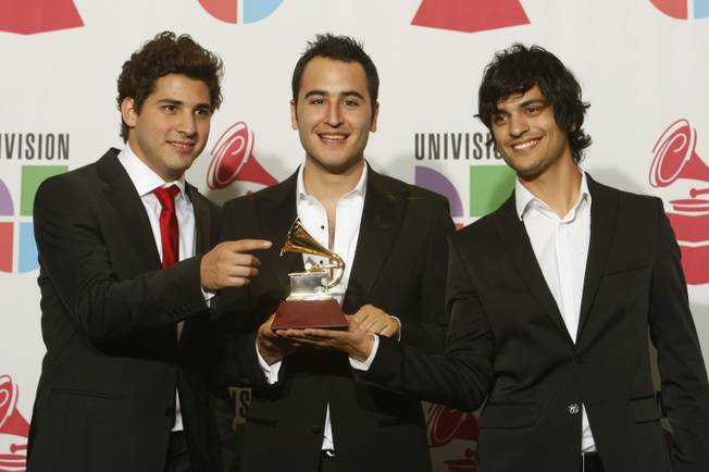 The band Reik hold the award for Best Pop Album by a Duo or Group with Vocal at the 10th annual Latin Grammy Awards at the Mandalay Bay Events Center.