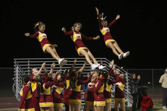 Del Sol cheerleaders celebrate in the end zone after the Dragons scored their sixth touchdown against the Cougars en route to winning the Henderson-based Southeast Division title with a win against Coronado.