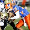 Bishop Gorman freshman quarterback Anu Solomon runs into the Cheyenne Desert Shields line Friday nig