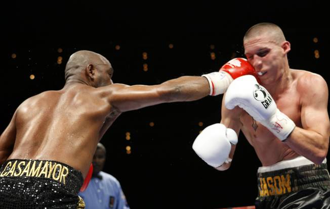 Former WBC lightweight champion Joel Casamayor, left, connects with a jab on Jason Davis during an eight-round super lightweight fight at The Pearl in The Palms Friday. Casamayor won the fight by unanimous decision.