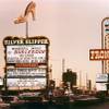 In this 1968 photo,  the marquees of three Howard Hughes hotels light up at dusk. Rumors flew at the