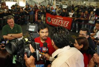Manny Pacquiao of the Philippines interviewed before a workout at the Wild Card Boxing Club in Los Angeles Wednesday, Nov. 4, 2009. Pacquiao will challenge WBO welterweight champion Miguel Cotto of Puerto Rico for the title at the MGM Grand Garden Arena on Nov. 14. 