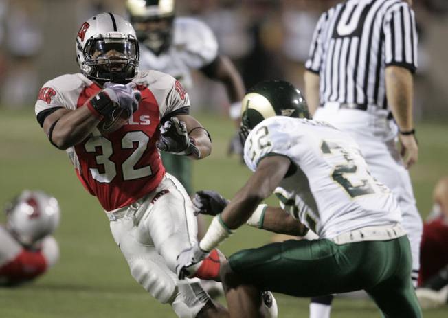UNLV running back Channing Trotter tries to elude Colorado State defensive back Elijah-Blu Smith during the second half of their game Saturday, November 7, 2009 at Sam Boyd Stadium.  UNLV won the game 35-16.