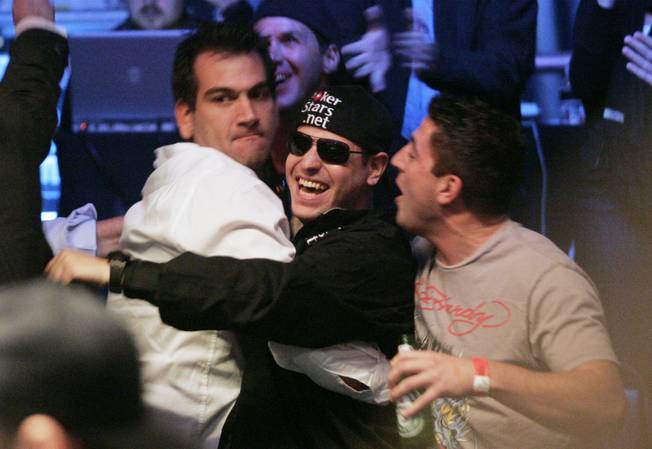 Eric Buchman celebrates with friends after drawing a king on both the flop and the turn, making four of a kind, to knock out Kevin Schaffel during the final table of the 2009 World Series of Poker Saturday, November 7, 2009 at the Rio.  