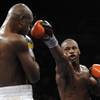 Chad Dawson, right, trades punches with Glen Johnson during their WBC Interim / IBO Light Heavyweigh
