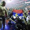 Fedor Emelianenko of Russia, celebrates with fans after knocking out Brett Rogers in the second roun