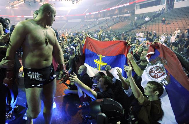 Fedor Emelianenko of Russia, celebrates with fans after knocking out Brett Rogers in the second round of the Strikeforce Mixed Martial Arts match at The Sears Centre Arena in Hoffman Estates, Ill. Saturday, Nov. 7, 2009. 