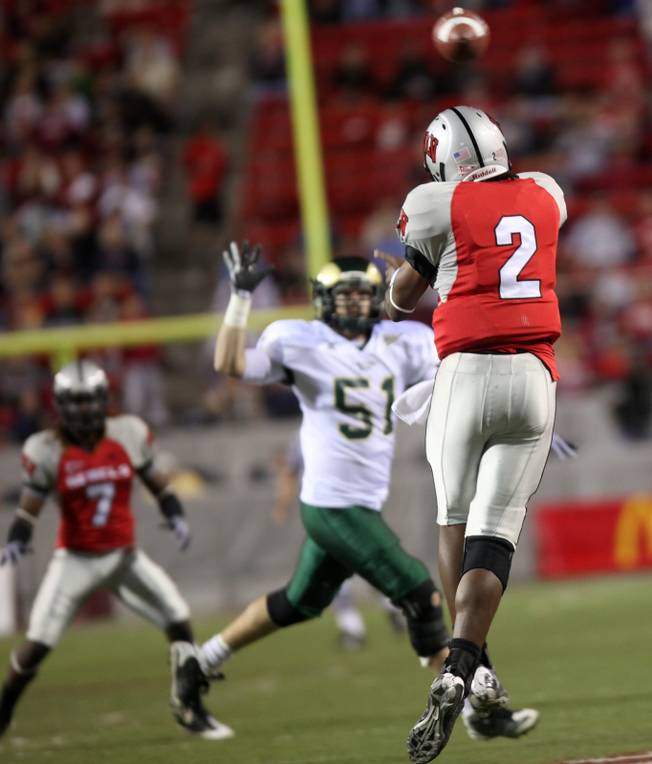 UNLV quarterback Omar Clayton throws a pass to Michael Johnson during the game against Colorado St. at Sam Boyd Stadium Saturday.  UNLV came out on top 35-16..