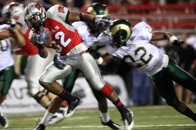 UNLV running back Channing Trotter breaks a tackle during the game against Colorado St. at Sam Boyd Stadium Saturday.  UNLV came out on top 35-16..