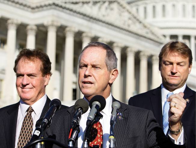 
Rep. Dean Heller, R-Nev., right, stands with Rep. Joe Wilson, R-S.C., center, and Rep. Phil Gingrey, R-Ga., Wednesday in Washington. Heller has aligned with Wilson in seeking assurances that illegal immigrants would be blocked from coverage under government-sponsored health care. 
