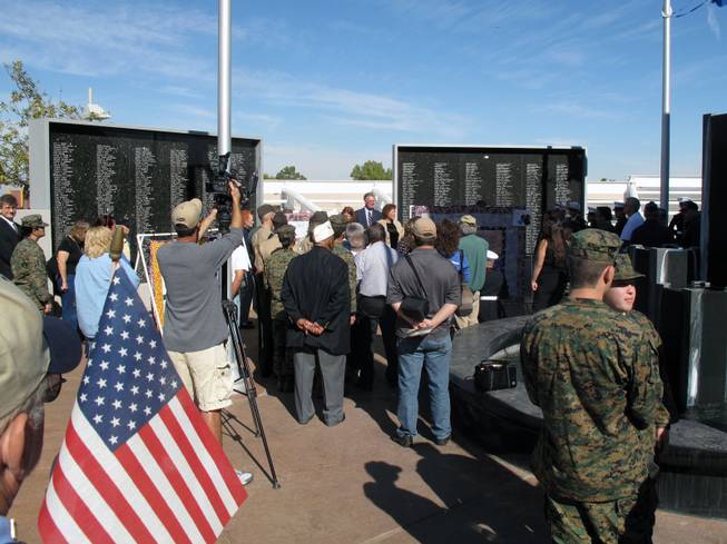 After the ceremony, veterans, city officials and others paid their respects at the Henderson Veterans Memorial Wall.
