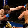 Mike Brown (right) lands a straight left hand to Urijah Faber during their WEC featherweight champio