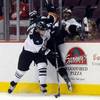 Mick Lawrence staples Utah's Ryan Kotsopoulus to the boards as the Wranglers and the Grizzlies met for the first of seven straight matches on Tuesday night at the Orleans Arena.