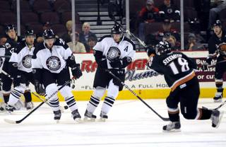 Utah forward James Sixsmith rips a slapshot between Josh Prudden, right, and Andrew Orpik during the second period at the Orleans Arena on Tuesday night.