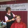 Johnathan Short from Memphis, Tenn. gets his hair cut by Maui Salon hairdresser Vickie McColl during