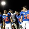 Bishop Gorman football coach Tony Sanchez puts his arms around running backs Victor Belen (left) and Shaquille Powell following the Gaels 38-28 victory Friday in the Sunset Regional semifinals.