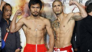 Manny Pacquiao, left, of the Philippines and WBO welterweight champion Miguel Cotto of Puerto Rico pose during an official weigh-in at the MGM Grand Garden Arena on Friday, Nov. 13, 2009. The boxers will fight at the arena on November 14.  