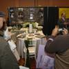 Raul Gutierrez takes a photograph of table-setting designs on display while attending the LGBT Wedding Expo with his friend, Tom Berman, Sunday at the JW Marriott Las Vegas Resort & Spa.