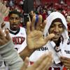 UNLV's Tre'Von Willis and Justin Hawkins high five fans Saturday after defeating Pittsburg State in the season opener for both teams at the Thomas & Mack Center. The Rebels blew it open in the second half with a 91-52 victory.