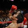 Manny Pacquiao reacts following his WBO welterweight title fight against Miguel Cotto Saturday at th