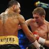 Daniel Santos, left, of Puerto Rico takes a punch from Yuri Foreman during the WBA  super welterweig