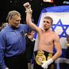 Yuri Foreman has his hand raised in triumph after defeating Daniel Santos on Saturday night at the MGM Grand Garden Arena to claim the WBA super welterweight title. The 29-year-old Israeli won by unanimous decision.