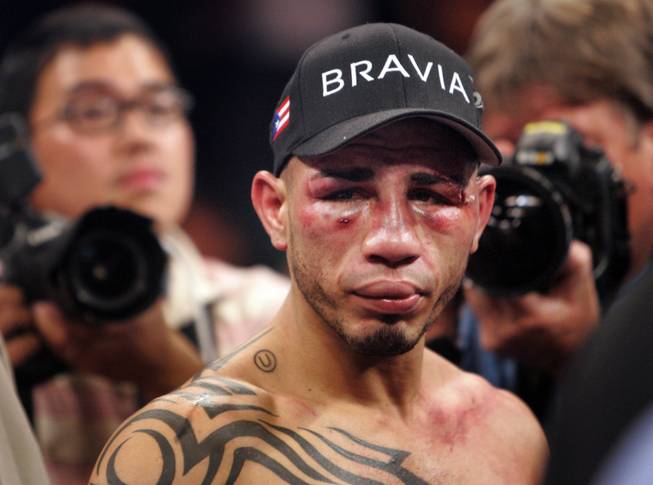 Miguel Cotto remains in the ring following his 12th-round TKO defeat at the hands of Manny Pacquiao on Saturday, Nov. 14 at the MGM Grand Garden Arena.