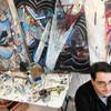 Artist Sean Russell starts working in his studio at about 4 or 5 a.m. and paints while listening to 