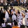 Former UNLV center Louis Amundson (in the center holding a towel around his neck), a fan favorite in Phoenix, looking on in a Suns' huddle during a Sunday timeout of an eventual victory over Toronto.