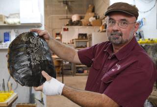 Taxidermist Rick Smith, owner of A+ Taxidermy, displays a turtle shell at his shop in Henderson on Thursday, Nov. 12, 2009. Smith is one of the few taxidermists who will mount pets. 