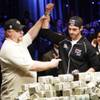 
Darvin Moon, left, a 45-year-old logger from Maryland, holds up the arm of Joe Cada, a 21-year old Internet poker whiz kid from Michigan, after losing to Cada at the World Series of Poker on Nov. 10 at the Rio. Cada won $8.5 million. 