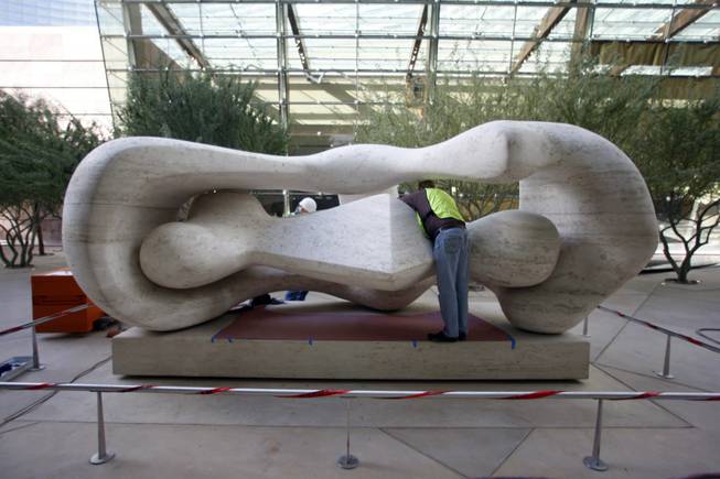 Works install "Reclining Connected Forms" by artist Henry Moore in a pocket park during a tour of MGM Mirage's CityCenter project Wednesday, Nov. 18, 2009. Properties in the $8.5 billion project will open next month. 