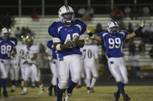 Basic running back Quinn Richardson celebrates after the Wolves recovered a kickoff fumble against Foothill during the Sunrise Region semifinal game Friday night at Basic. The Wolves were victorious over the Falcons 42-20.
