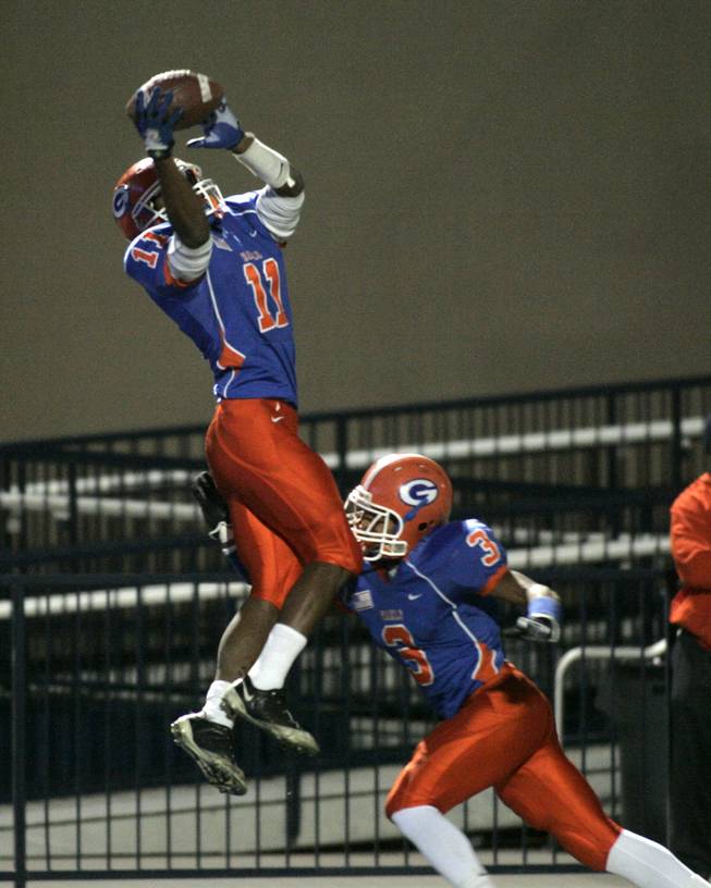 Bishop Gorman defensive back Taylor Spencer pulls in an interception against Cimarron-Memorial during their Sunrise Division championship game Friday, Nov. 20, 2009. Gorman won the game, 31-7, to advance to the state semifinals.