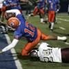 Bishop Gorman quarterback Anu Solomon dives into the end zone against Cimarron-Memorial during the Sunrise Division championship game Friday. Bishop Gorman won the game to advance to the state semifinals. Bishop Gorman quarterback Anu Solomon dives into the end zone against Cimarron-Memorial during the Sunrise Division championship game Friday. Bishop Gorman won the game to advance to the state semifinals.